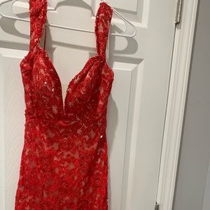 Worn once! Red lace fitted short dress with open back and beaded detail! Size 4